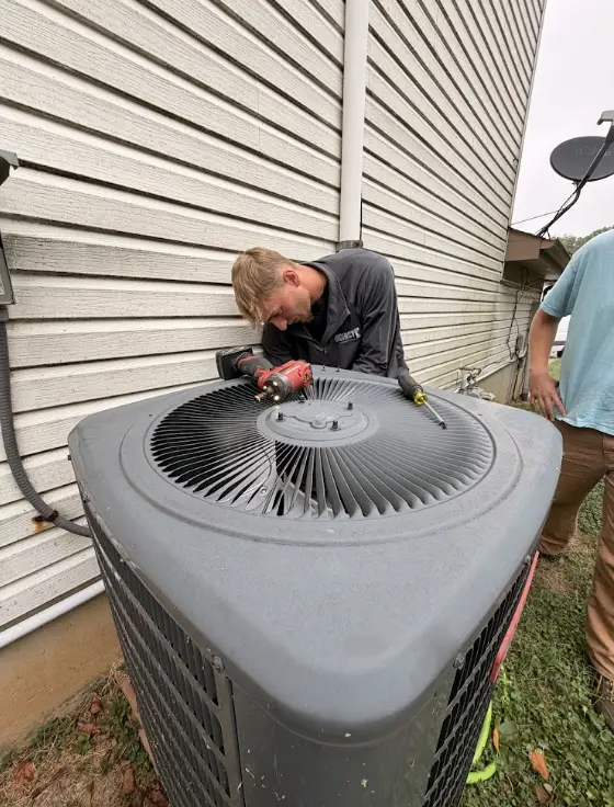 HVAC technician performing an AC repair in Cincinnati